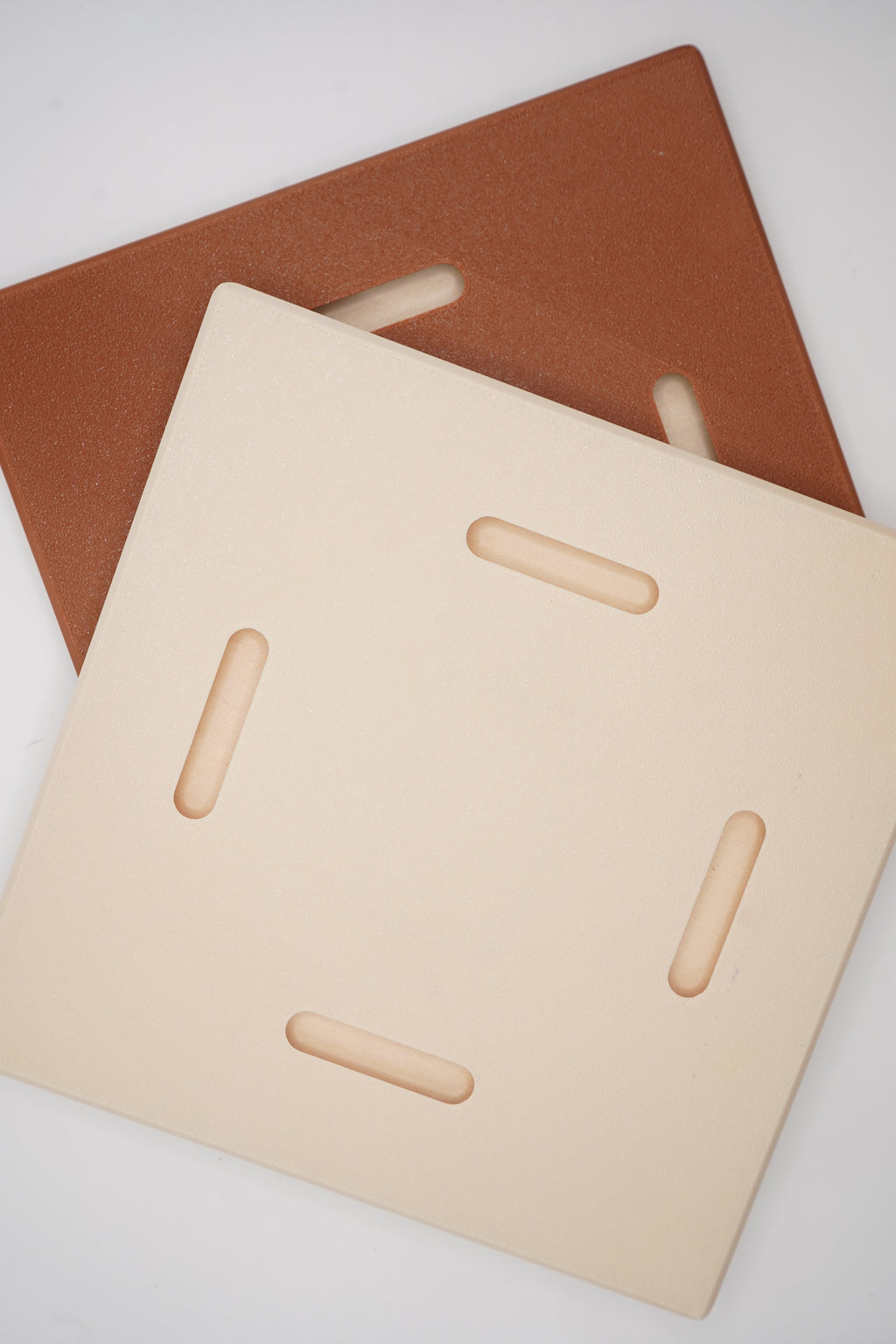 Shadowbox Frame in beige and brown, unpainted, showing the back with mounting slots